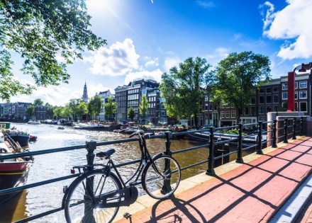 bike along canal in amsterdam