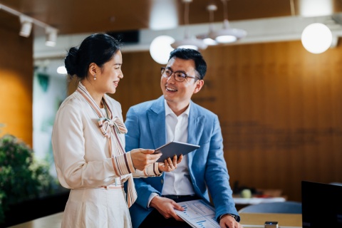 Office workers in China discussing Chinese business etiquette