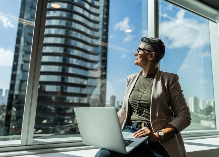 Businesswoman looking out the window in office in Uruguay