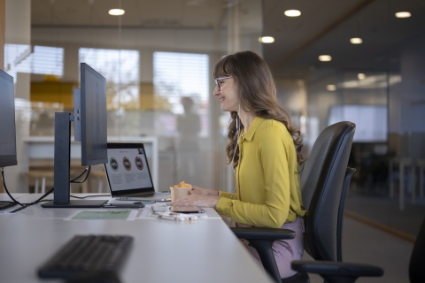HR manager smiles while building an HR tech stack