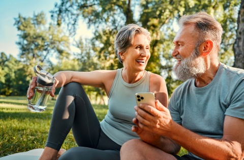 Smiling couple in a park enjoying Albania’s public holidays