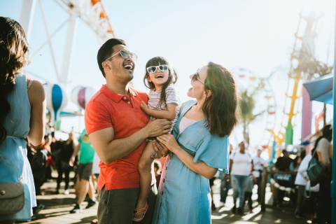 Family at a fair enjoying the United States's public holidays