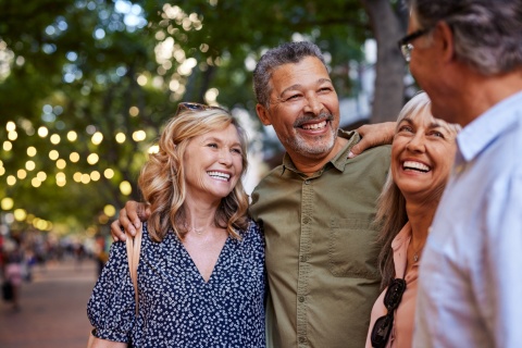 Group of happy senior friends sharing a moment outdoors