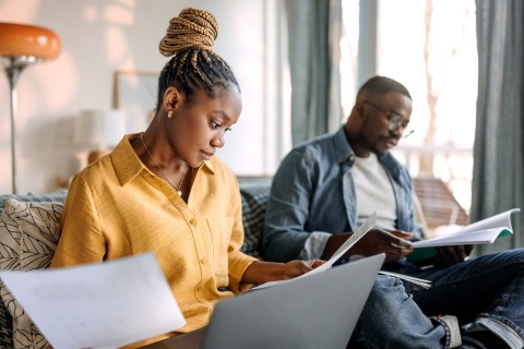 Two colleagues read about how to get work authorization in brazil