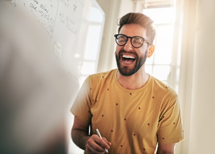 Global HR team member laughing at work
