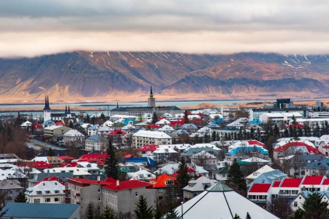 The rooftops of Reykjavik in Iceland with mountains in the background
