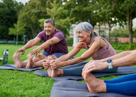 People doing yoga in a park during Tunisia's public holidays