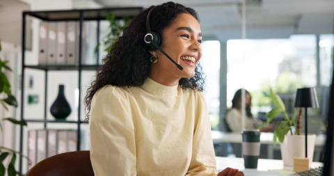 Global HR manager discussing payroll tax in El Salvador on a headset