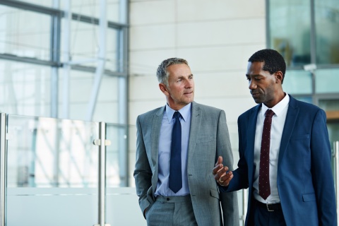 HR managers discussing the average salary in Rwanda