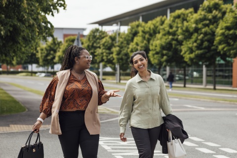 Global HR team members discussing how to hire in Sri Lanka while walking