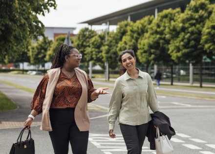 Global HR team members discussing how to hire in Sri Lanka while walking