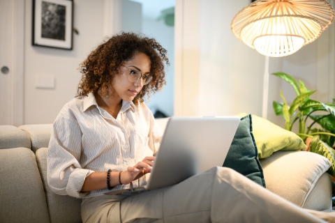 Business owner researching risk mitigation strategies during trade uncertainty